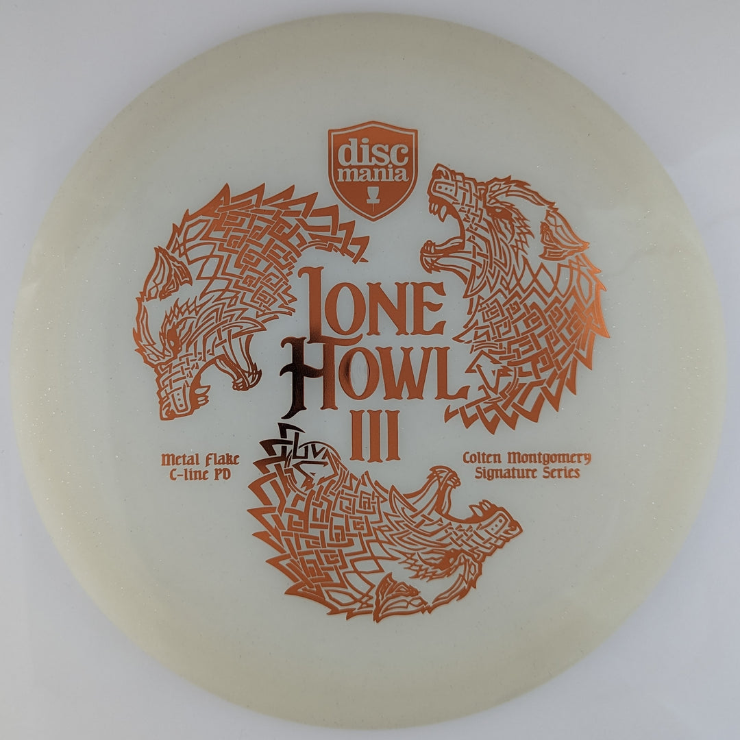 Transparent white Discmania PD Power Driver disc, made from C-Line plastic blend, with bronze Colten Montgomery Lone Howl foil stamp