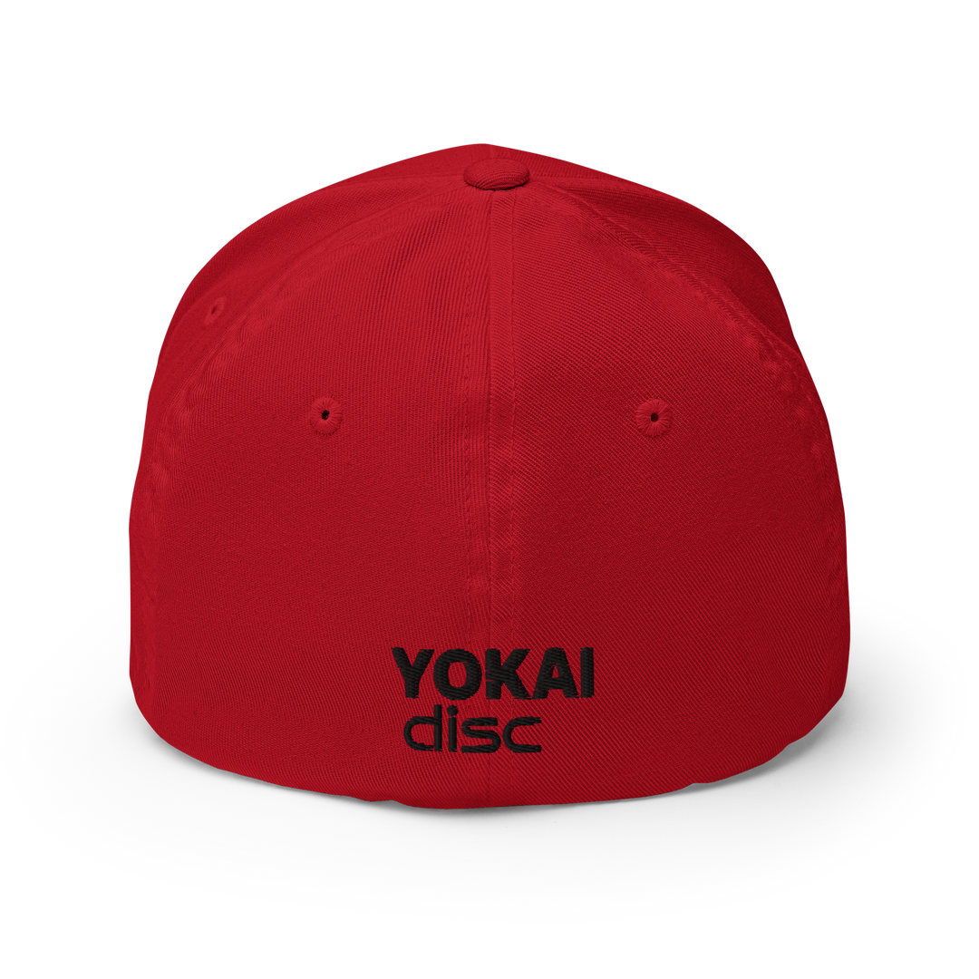 Back profile of red flexfit cap with black Yokai Disc's embroidered company name